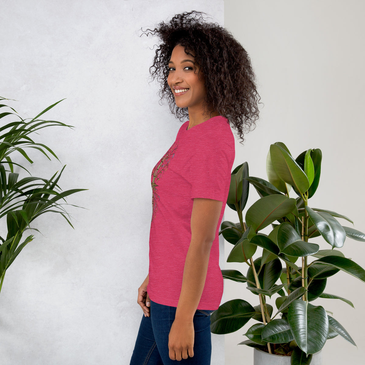 Own Your Grounded Energy design, an ornate tree with gold leaves and crystals in its roots, on a heather raspberry unisex t-shirt, left side view