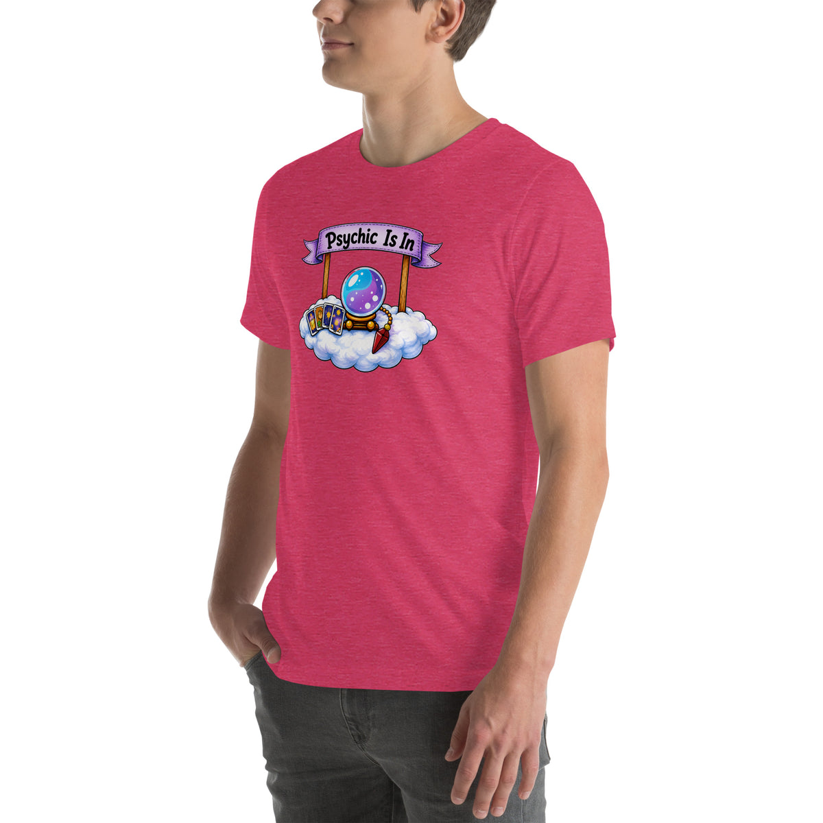 Psychic Is In design, playful floating clouds beneath a banner that reads Psychic Is Open for Business, on a heather raspberry unisex t-shirt, angled left front view