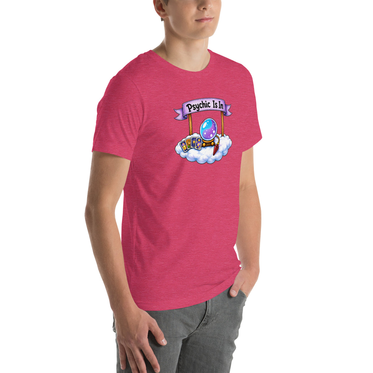 Psychic Is In design, playful floating clouds beneath a banner that reads Psychic Is Open for Business, on a heather raspberry unisex t-shirt, angled right front view