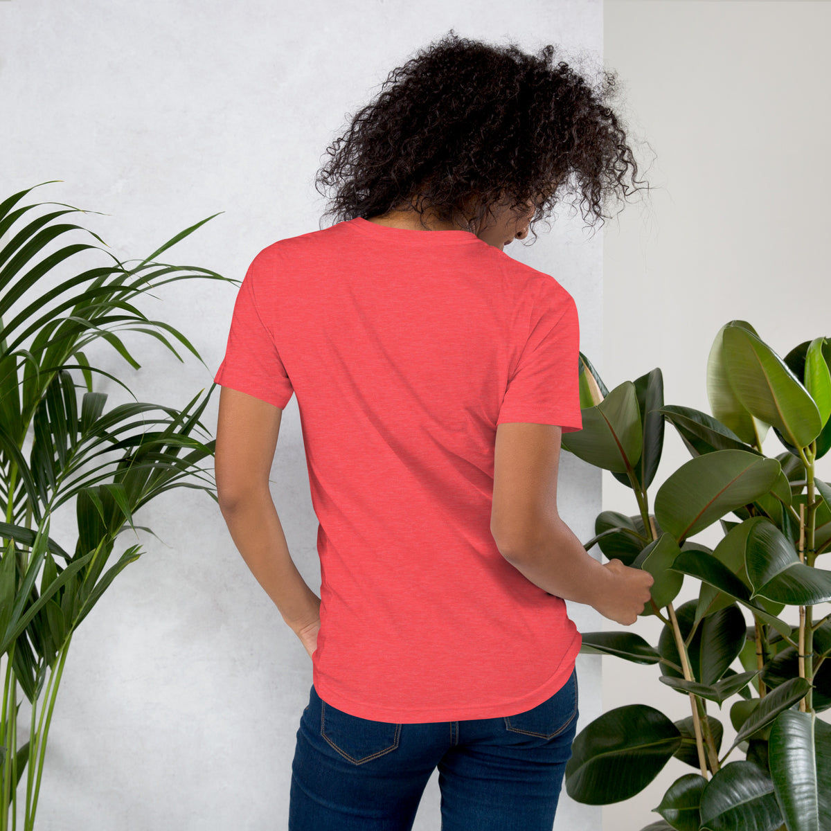 Own Your Grounded Energy design, an ornate tree with gold leaves and crystals in its roots, on a heather red unisex t-shirt, back view