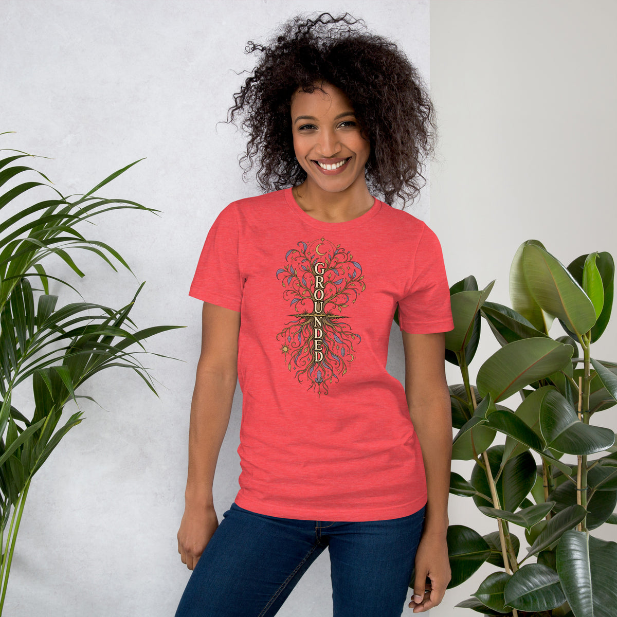 Own Your Grounded Energy design, an ornate tree with gold leaves and crystals in its roots, on a heather red unisex t-shirt, front view