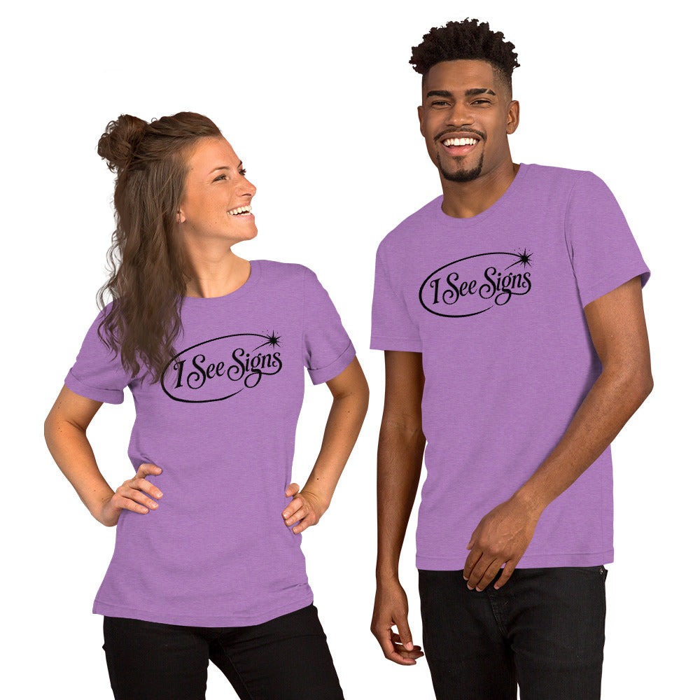 I See Signs design, the words set in black script inside a thin oval with a four-pointed star, on a heather team purple unisex t-shirt, front view