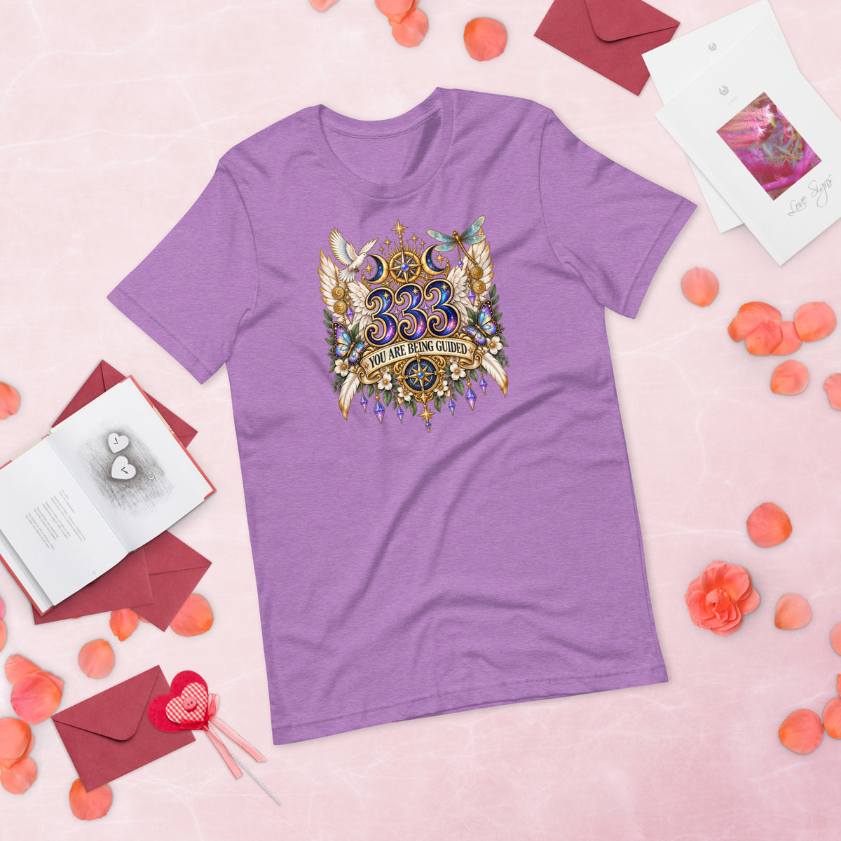 333 You Are Being Guided angel number design, a white dove, angel wings, a dragonfly and a compass rose, on a heather team purple unisex t-shirt, front view
