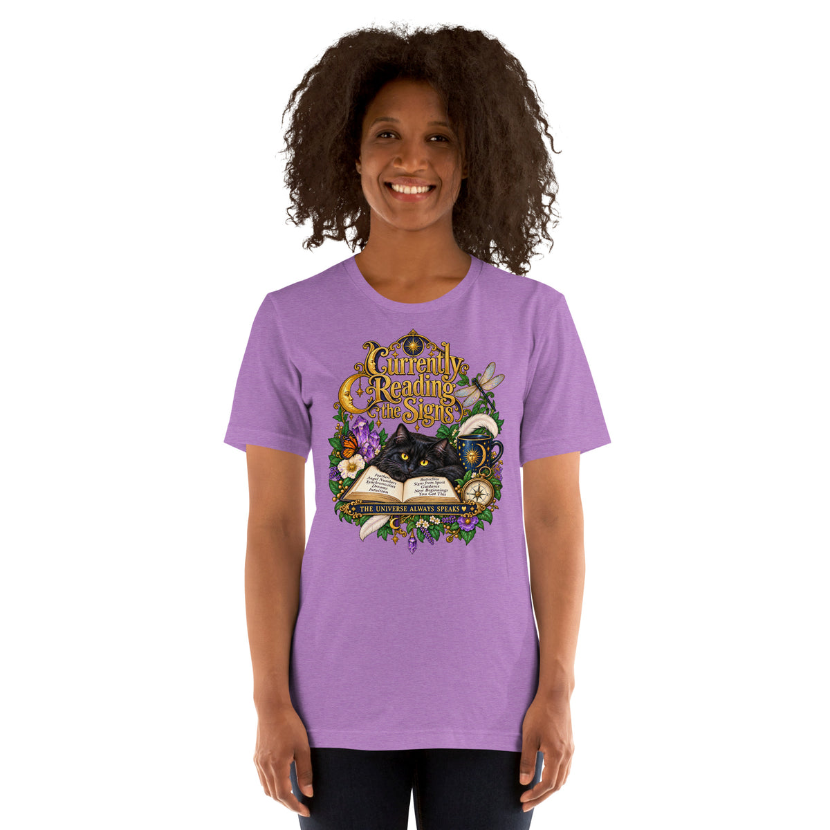 Currently Reading The Signs dark academia design, two black cats asleep over an open book beneath a crescent moon, on a heather team purple unisex t-shirt, front view