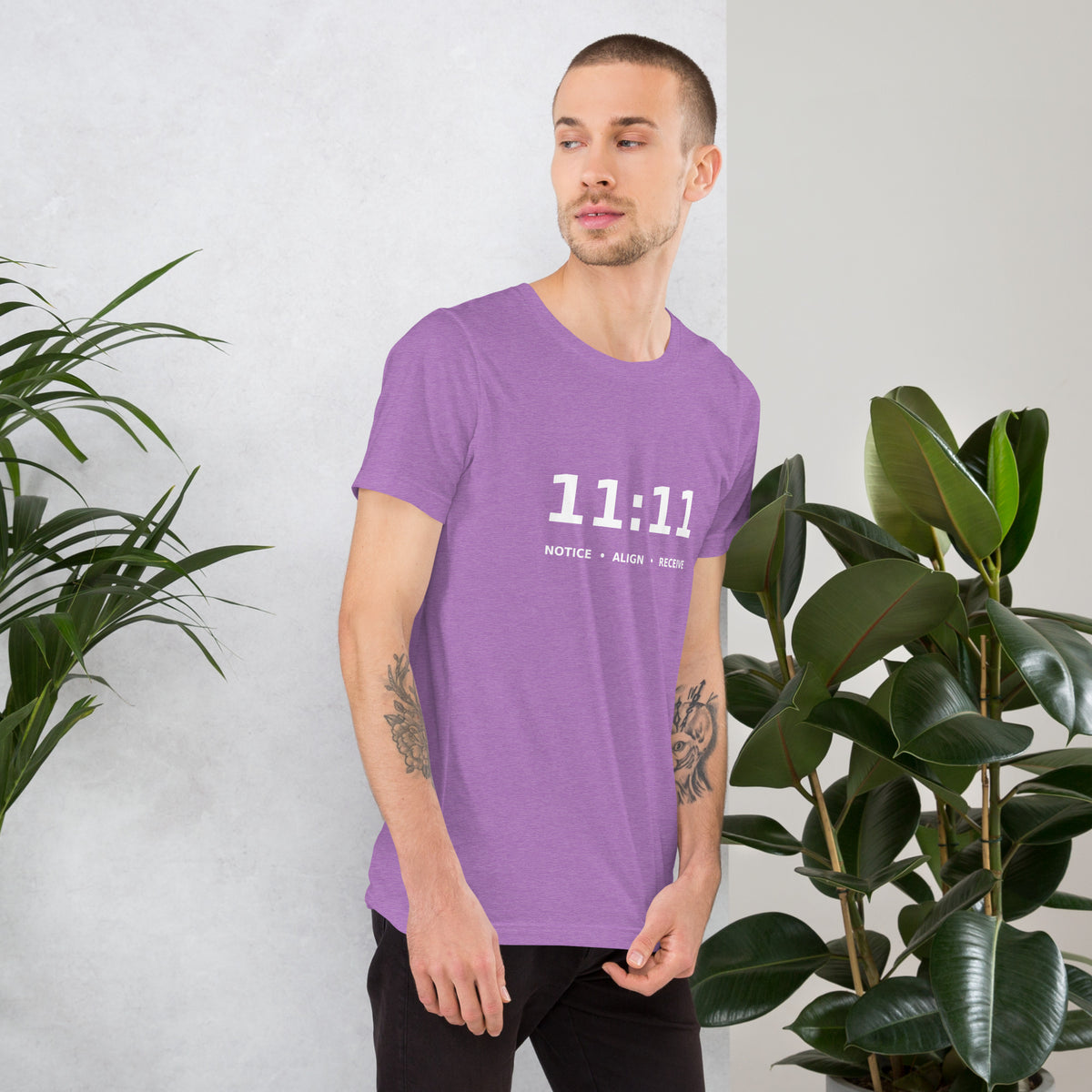 11:11 angel number design, the number set in plain white type above Notice, Align, Receive, on a heather team purple unisex t-shirt, right side view