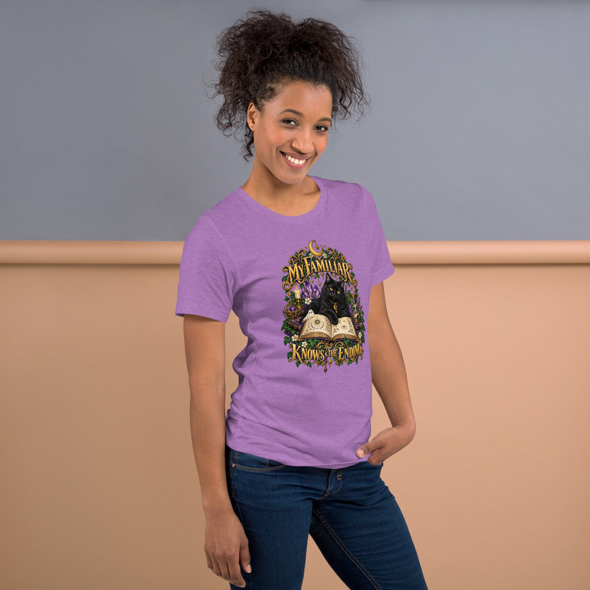 Black cat familiar on a grimoire, mystical design on a heather team purple unisex t-shirt, right side