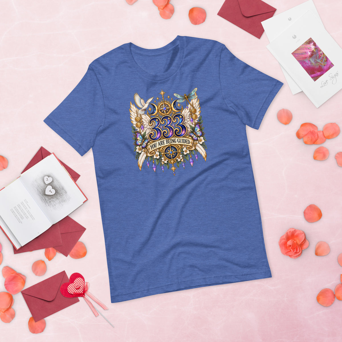 333 You Are Being Guided angel number design, a white dove, angel wings, a dragonfly and a compass rose, on a heather true royal unisex t-shirt, front view