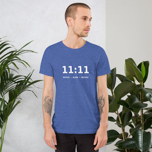11:11 angel number design, the number set in plain white type above Notice, Align, Receive, on a heather true royal unisex t-shirt, front view