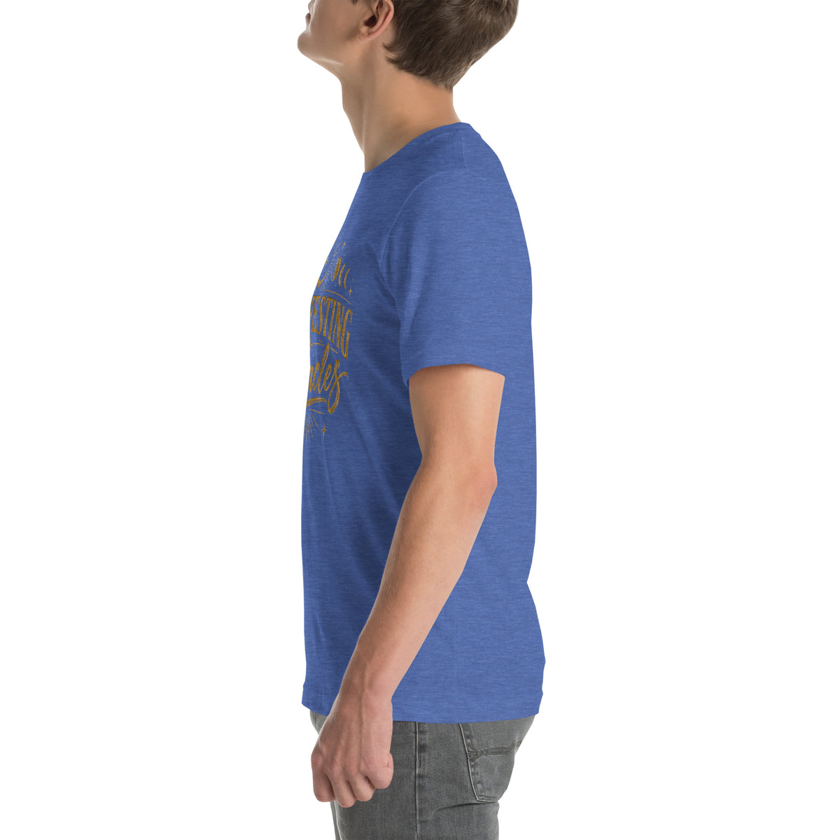 Manifesting Miracles design with moon phases in antique gold, on a heather true royal unisex t-shirt, left side view