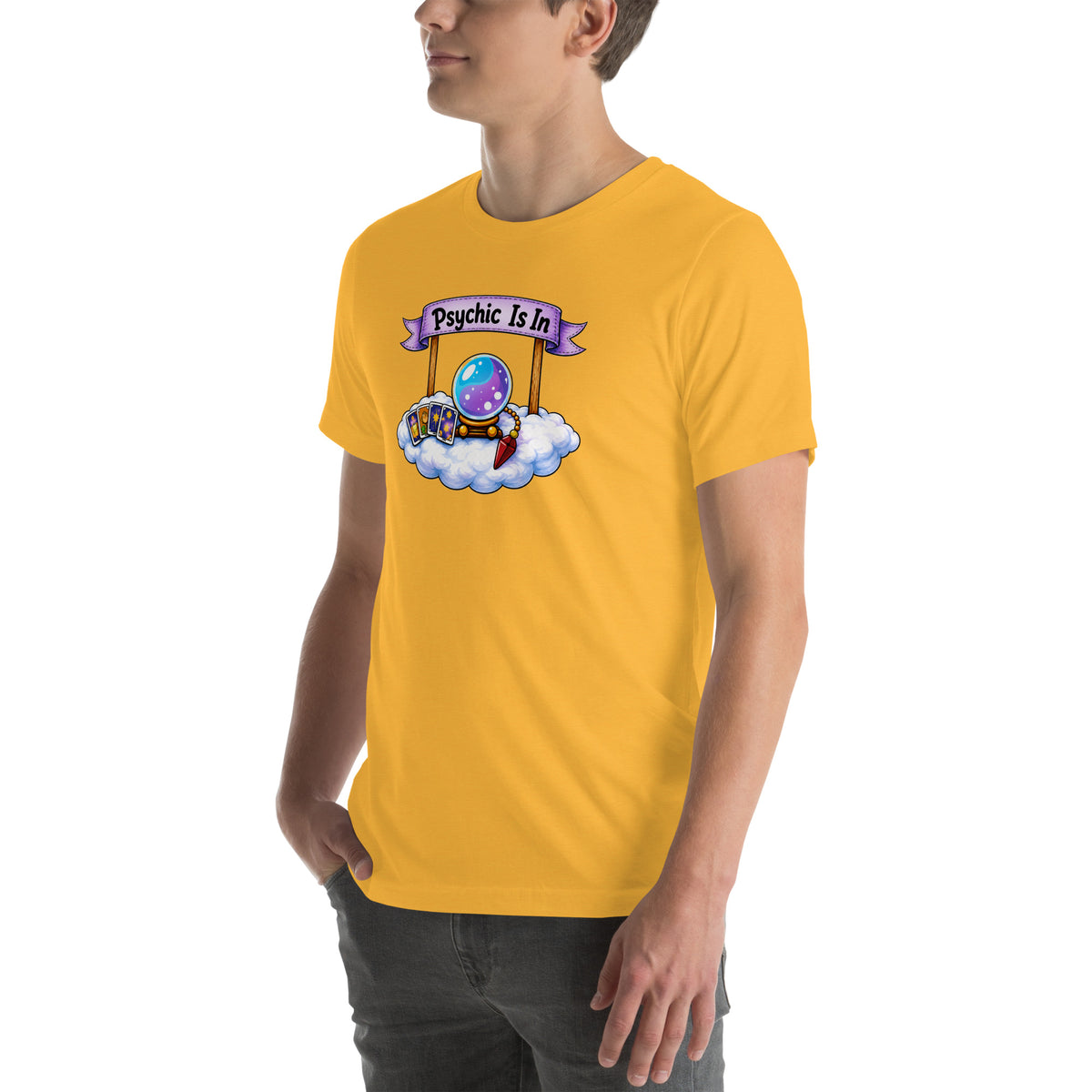 Psychic Is In design, playful floating clouds beneath a banner that reads Psychic Is Open for Business, on a heather yellow gold unisex t-shirt, angled left front view