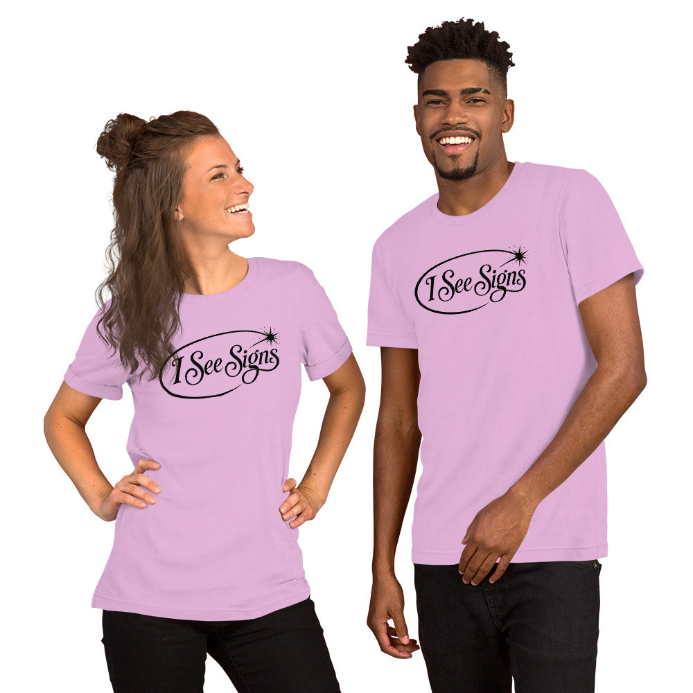 I See Signs design, the words set in black script inside a thin oval with a four-pointed star, on a lilac unisex t-shirt, front view