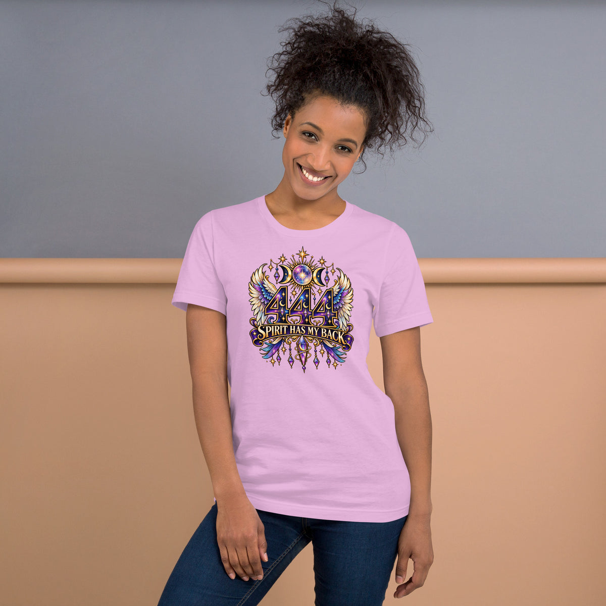 444 Spirit Has My Back angel number design, angel wings flanking the number beneath a galaxy orb and crescent moons, on a lilac unisex t-shirt, front view