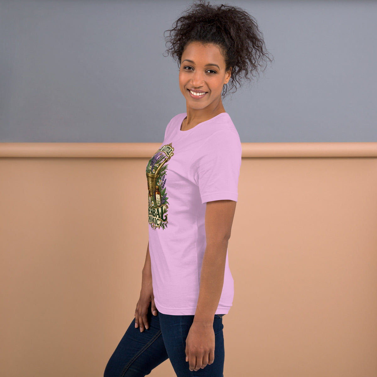 A Little Herbal Magic design, a gold mortar and pestle filled with lavender and chamomile, on a lilac unisex t-shirt, left side view