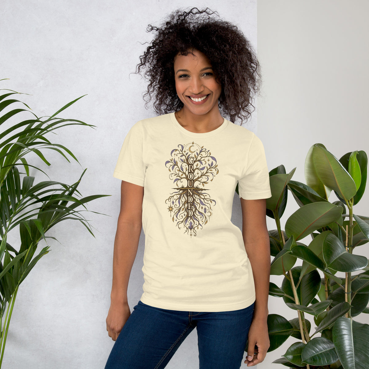 Own Your Grounded Energy design, an ornate tree with gold leaves and crystals in its roots, on a natural unisex t-shirt, front view