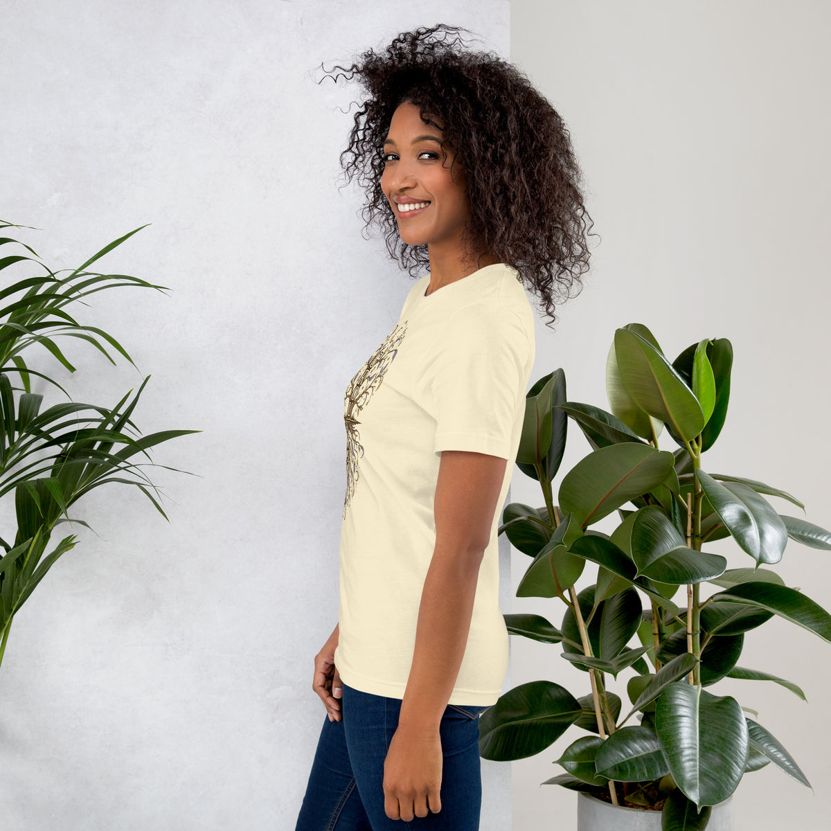 Own Your Grounded Energy design, an ornate tree with gold leaves and crystals in its roots, on a natural unisex t-shirt, left side view