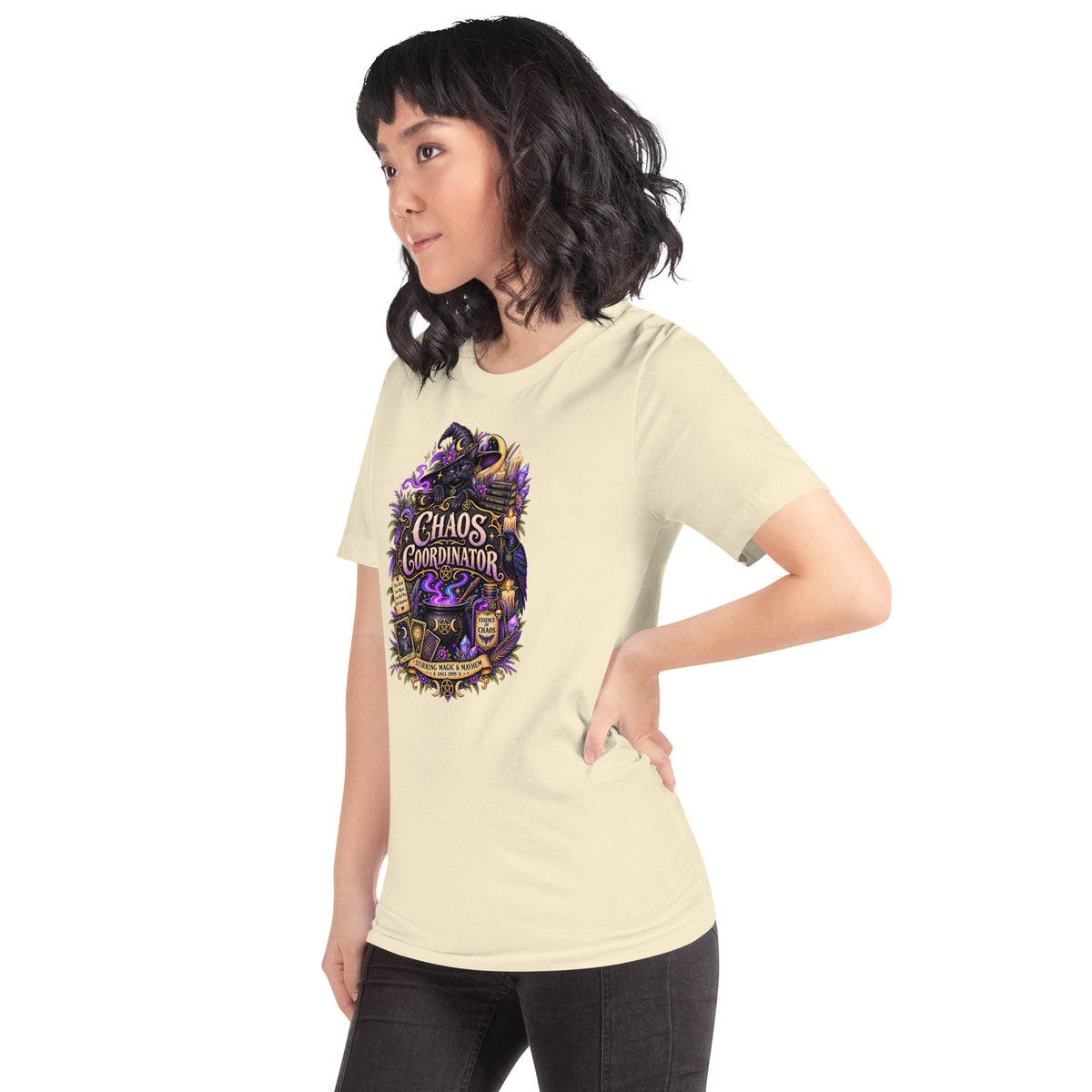 Chaos Coordinator whimsigoth design, a witchy black cat in a pointed hat, on a natural unisex t-shirt, left front view