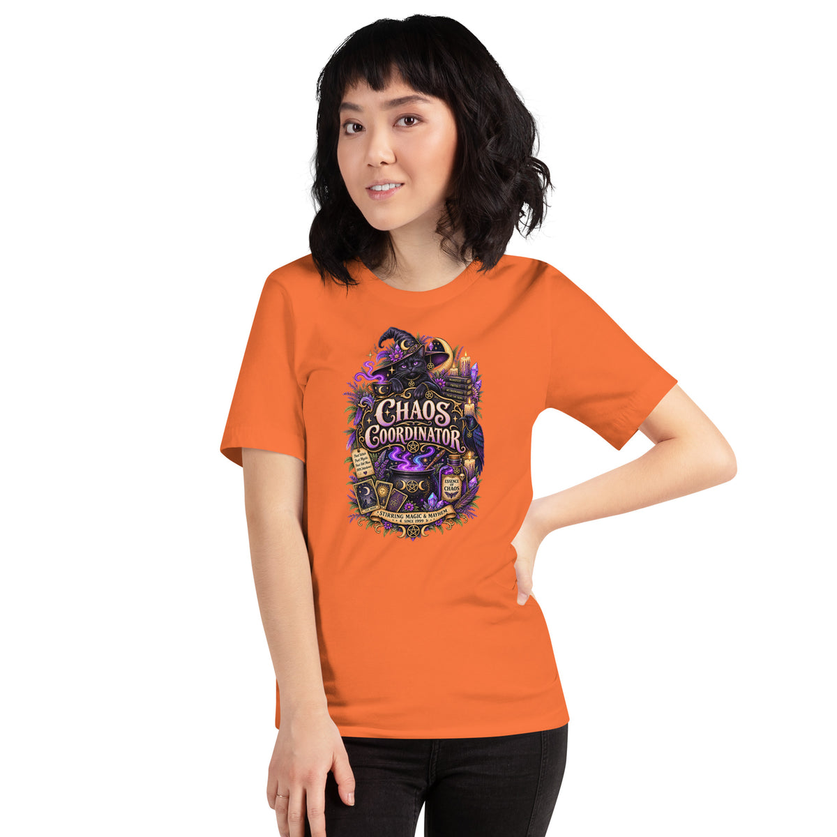 Chaos Coordinator whimsigoth design, a witchy black cat in a pointed hat, on an orange unisex t-shirt, front view
