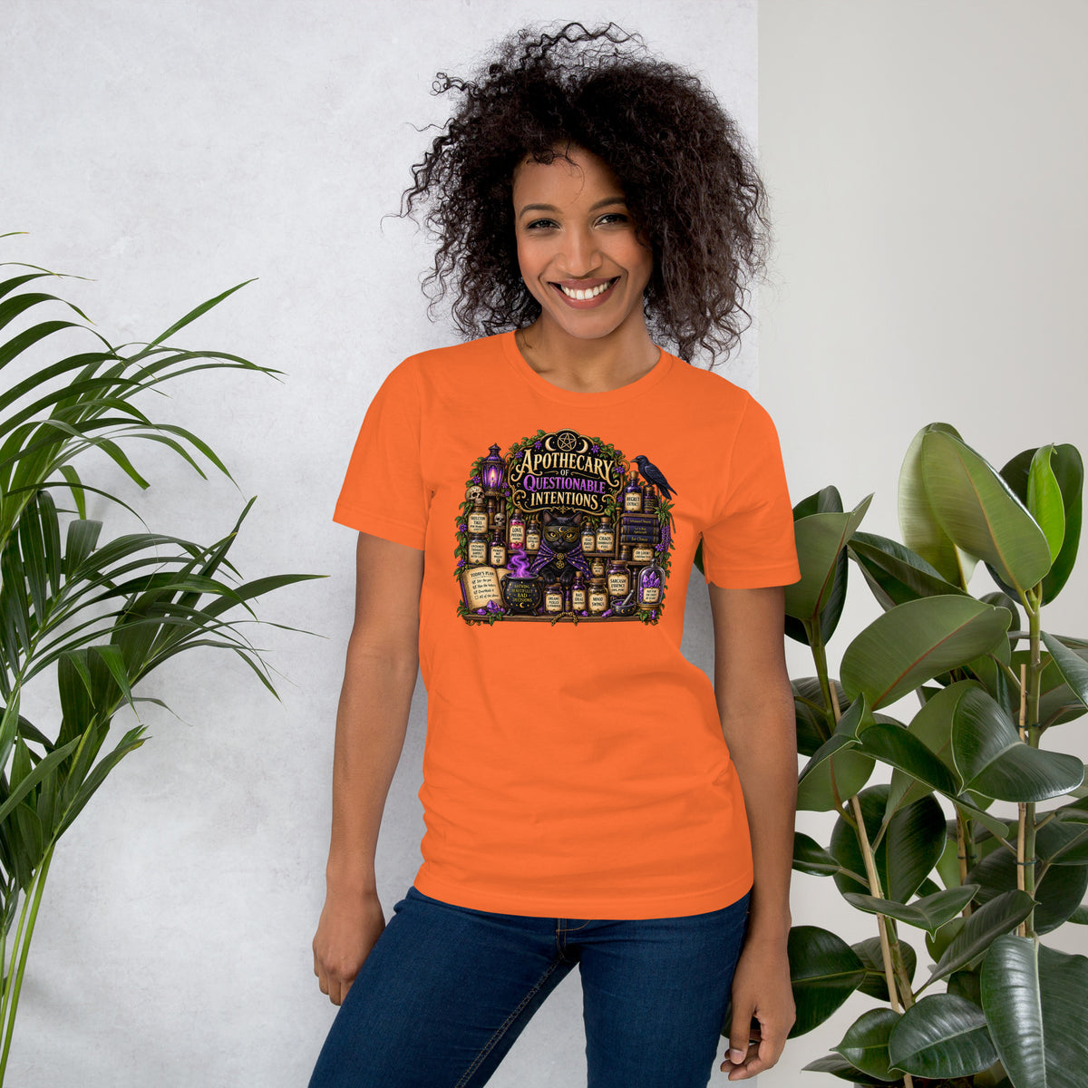 Apothecary of Questionable Intentions, a witchy black cat and two dozen potion bottles, on an orange unisex t-shirt, front view