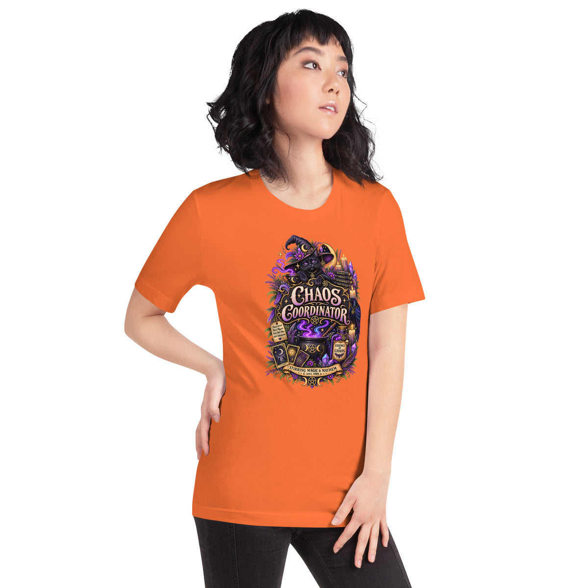 Chaos Coordinator whimsigoth design, a witchy black cat in a pointed hat, on an orange unisex t-shirt, right front view