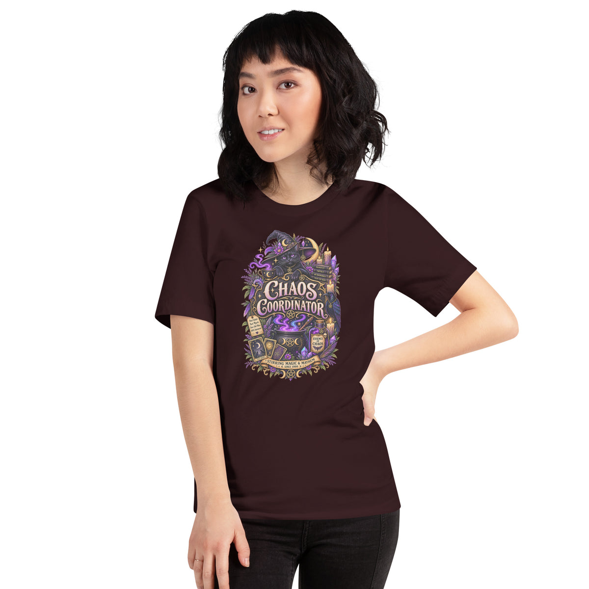 Chaos Coordinator whimsigoth design, a witchy black cat in a pointed hat, on an oxblood black unisex t-shirt, front view