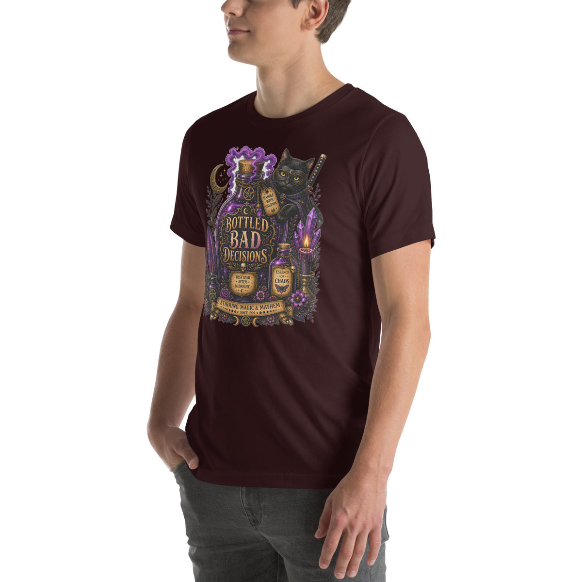 Bottled Bad Decisions whimsigoth design, a black cat and a glowing potion bottle, on an oxblood black unisex t-shirt, left front view