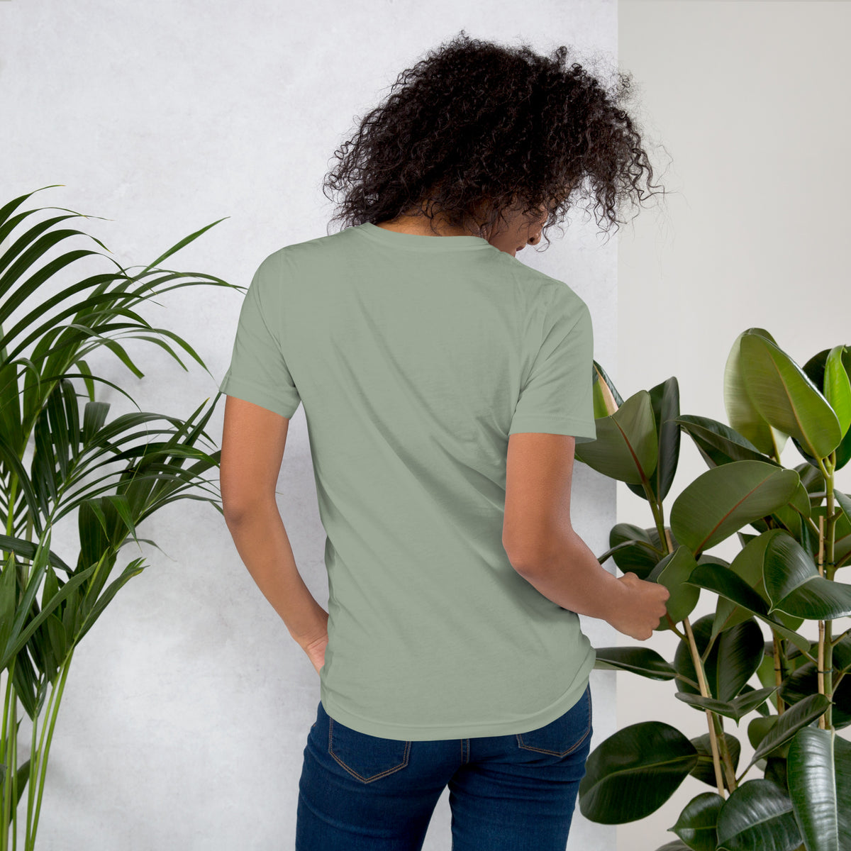 My Apothecary Has Trust Issues, a witchy black cat and a cabinet of potion bottles, on a sage unisex t-shirt, back view