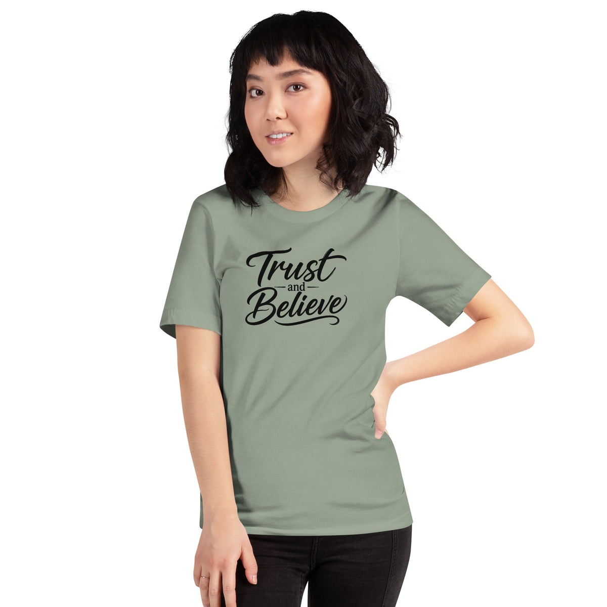 Trust and Believe design in black lettering, on a sage unisex t-shirt, front view