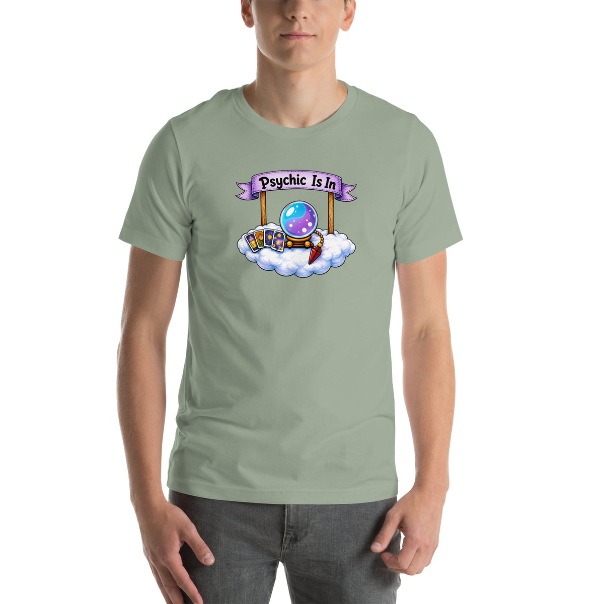 Psychic Is In design, playful floating clouds beneath a banner that reads Psychic Is Open for Business, on a sage unisex t-shirt, front view