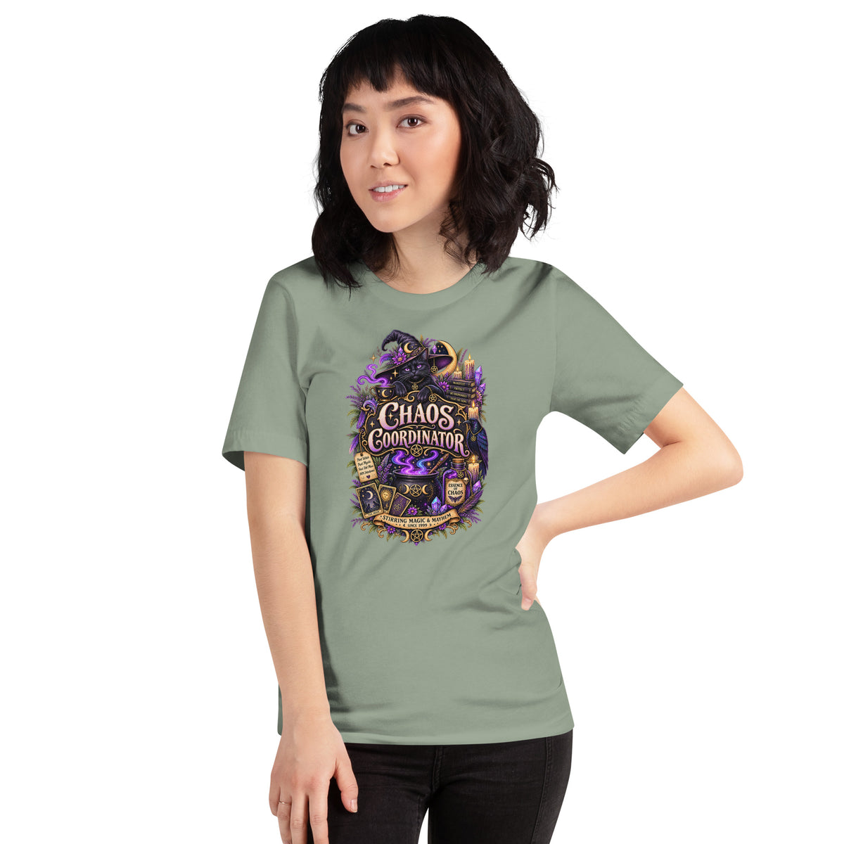 Chaos Coordinator whimsigoth design, a witchy black cat in a pointed hat, on a sage unisex t-shirt, front view