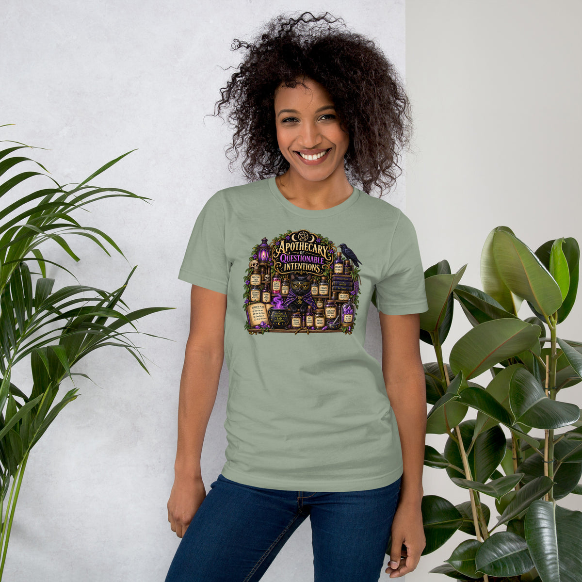 Apothecary of Questionable Intentions, a witchy black cat and two dozen potion bottles, on a sage unisex t-shirt, front view