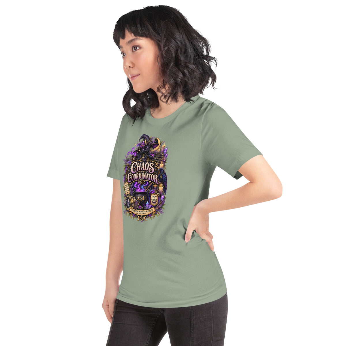 Chaos Coordinator whimsigoth design, a witchy black cat in a pointed hat, on a sage unisex t-shirt, left front view
