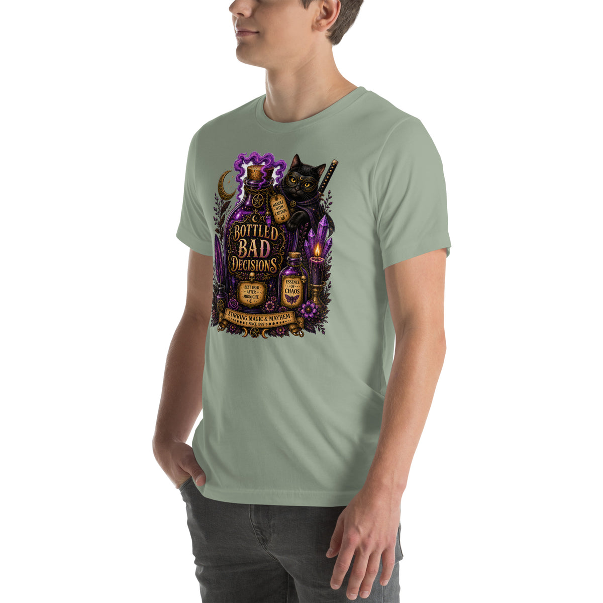 Bottled Bad Decisions whimsigoth design, a black cat and a glowing potion bottle, on a sage unisex t-shirt, left front view