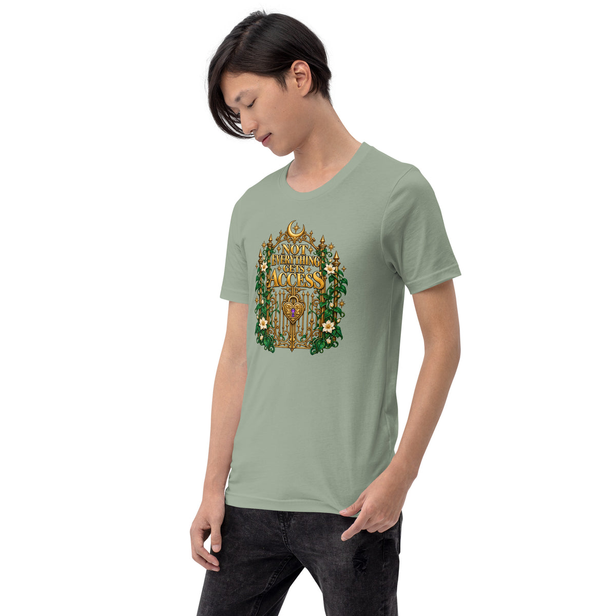 Not Everything Gets Access design, an ornate gold gate framed by ivy and white jasmine, on a sage unisex t-shirt worn by a model, angled to the left