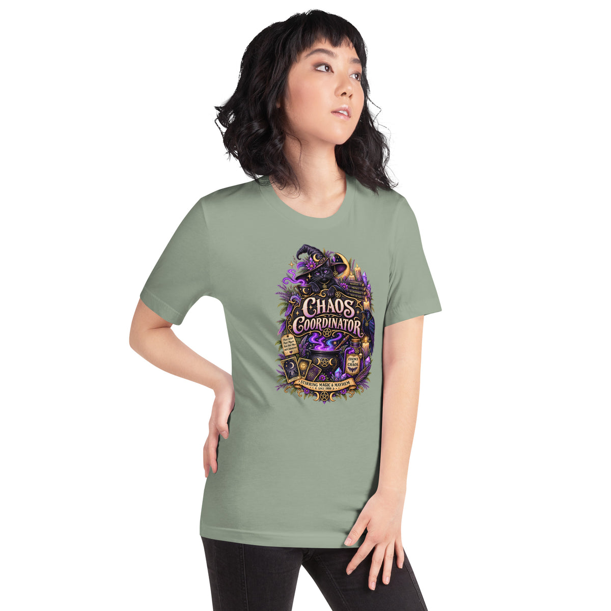 Chaos Coordinator whimsigoth design, a witchy black cat in a pointed hat, on a sage unisex t-shirt, right front view