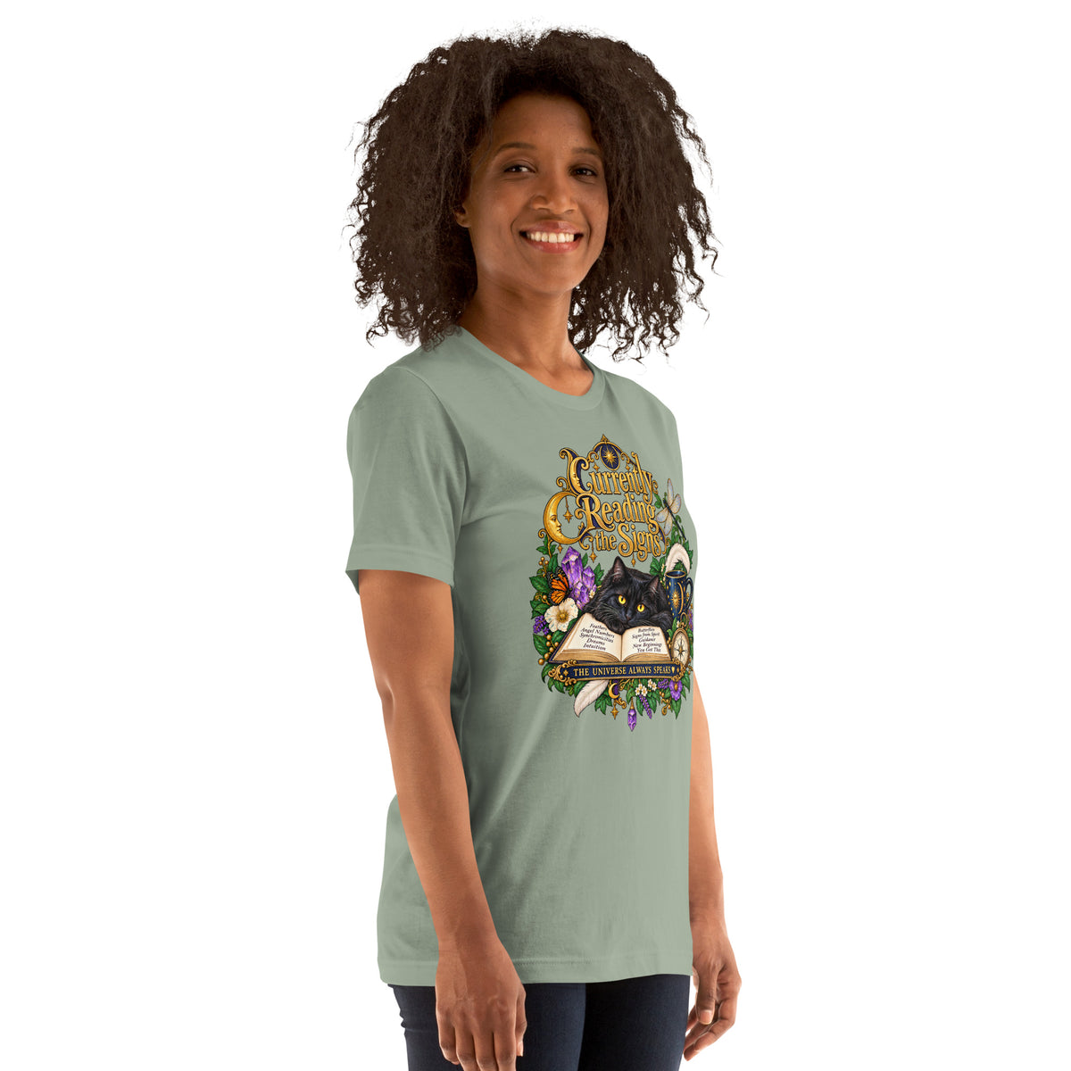 Currently Reading The Signs dark academia design, two black cats asleep over an open book beneath a crescent moon, on a sage unisex t-shirt, right front view