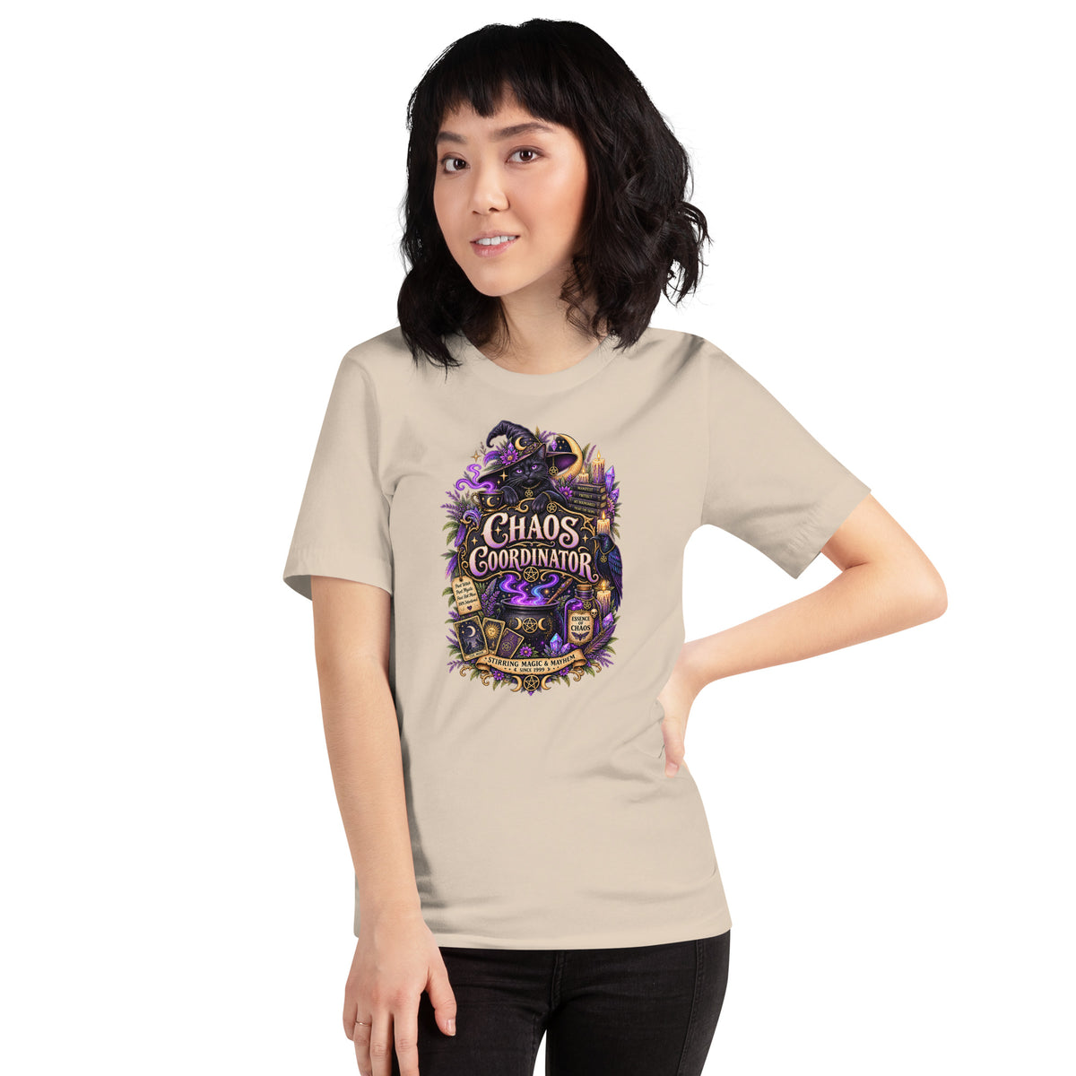 Chaos Coordinator whimsigoth design, a witchy black cat in a pointed hat, on a soft cream unisex t-shirt, front view