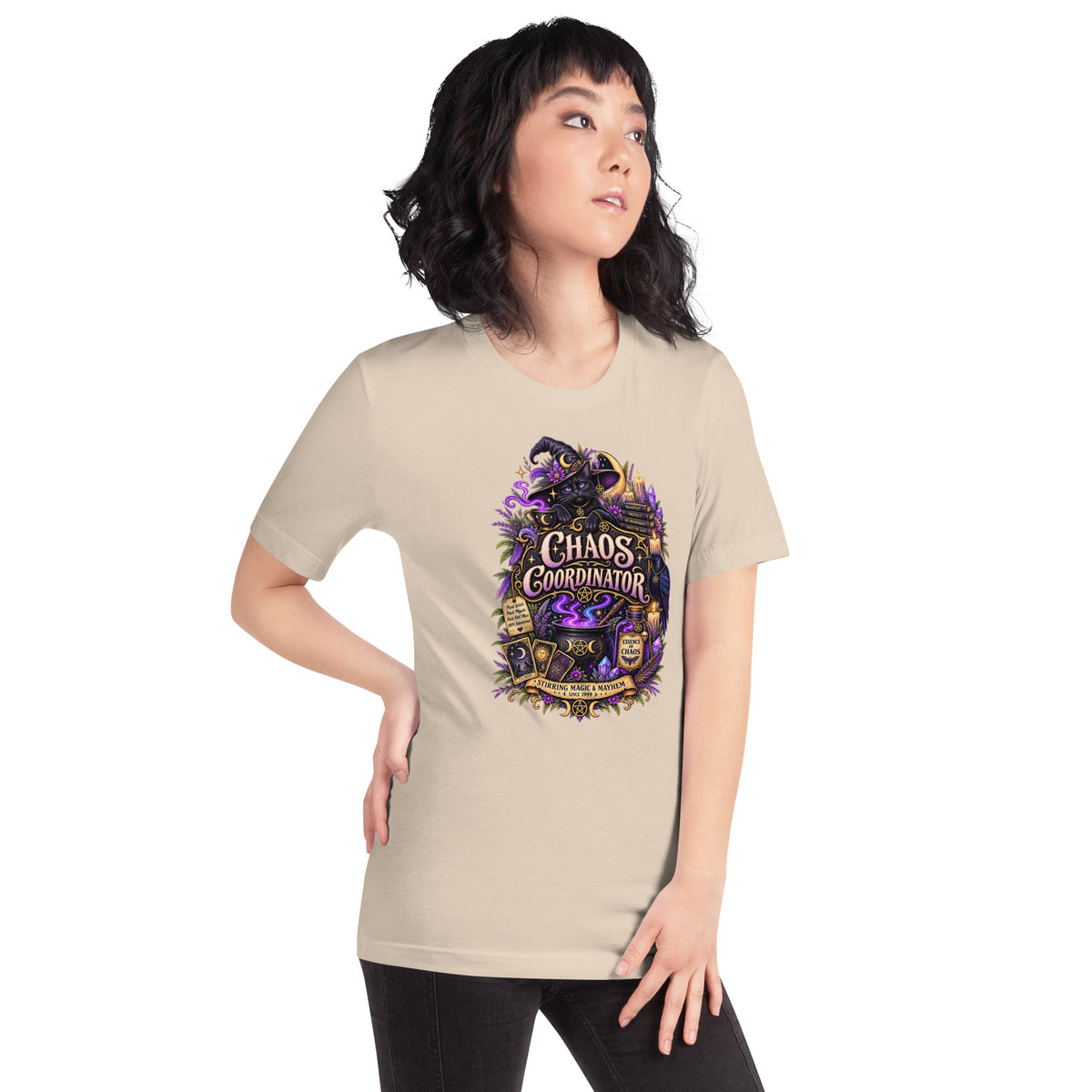 Chaos Coordinator whimsigoth design, a witchy black cat in a pointed hat, on a soft cream unisex t-shirt, right front view
