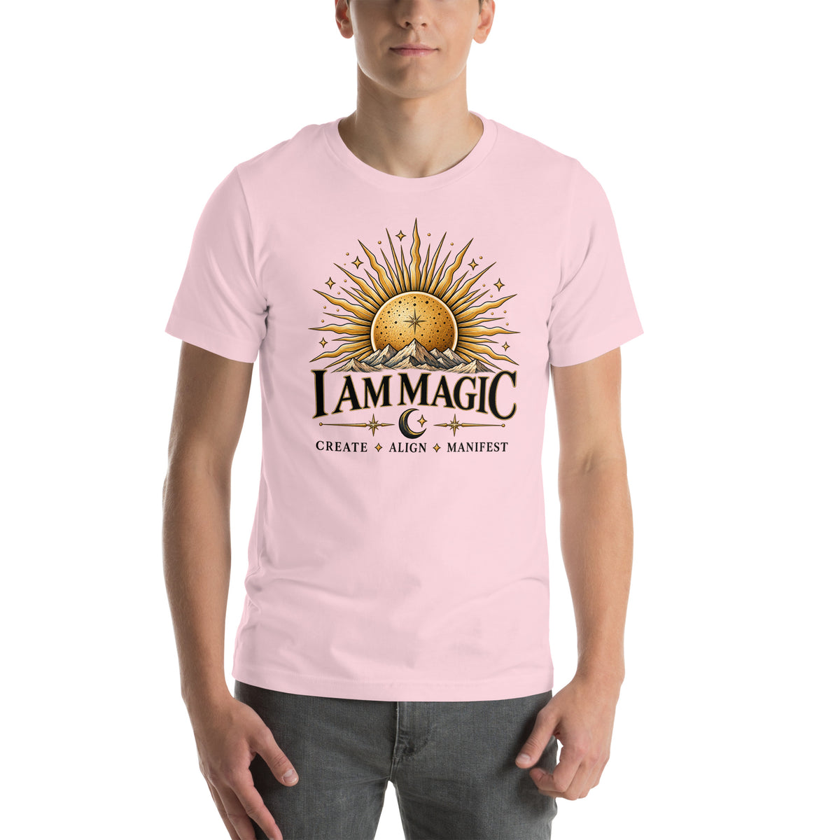 I Am Magic design with a gold sun face, Be Magical collection, on a soft pink unisex t-shirt, front view