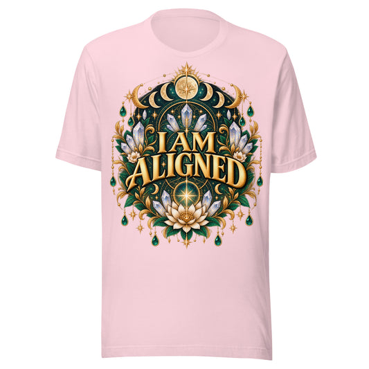 I Am Aligned affirmation design with a lotus, quartz and moon phases in gold, on a soft pink unisex t-shirt, front view