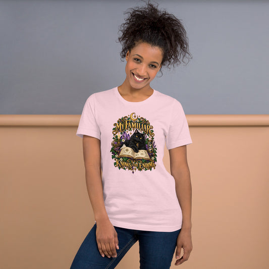 Black cat familiar on a grimoire, witchy celestial design on a soft pink unisex t-shirt, front view