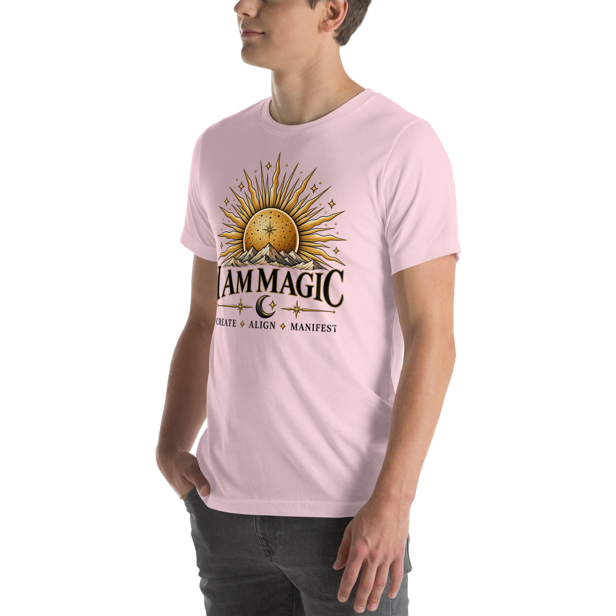 I Am Magic design with a gold sun face, Be Magical collection, on a soft pink unisex t-shirt, angled left front view