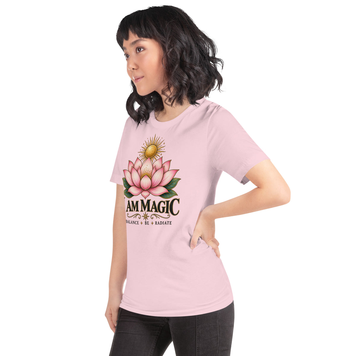 I Am Magic design with a gold lotus, Be Magical collection, on a soft pink unisex t-shirt, angled left front view