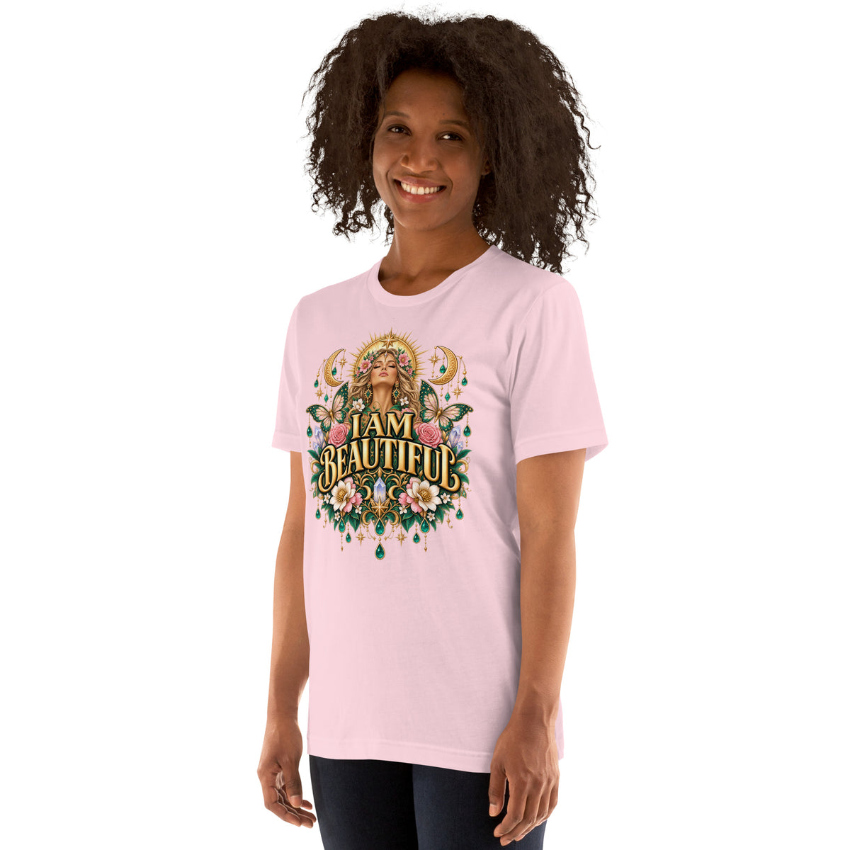 I Am Beautiful affirmation design with roses, butterflies and twin crescents in gold, on a soft pink unisex t-shirt, angled left front view