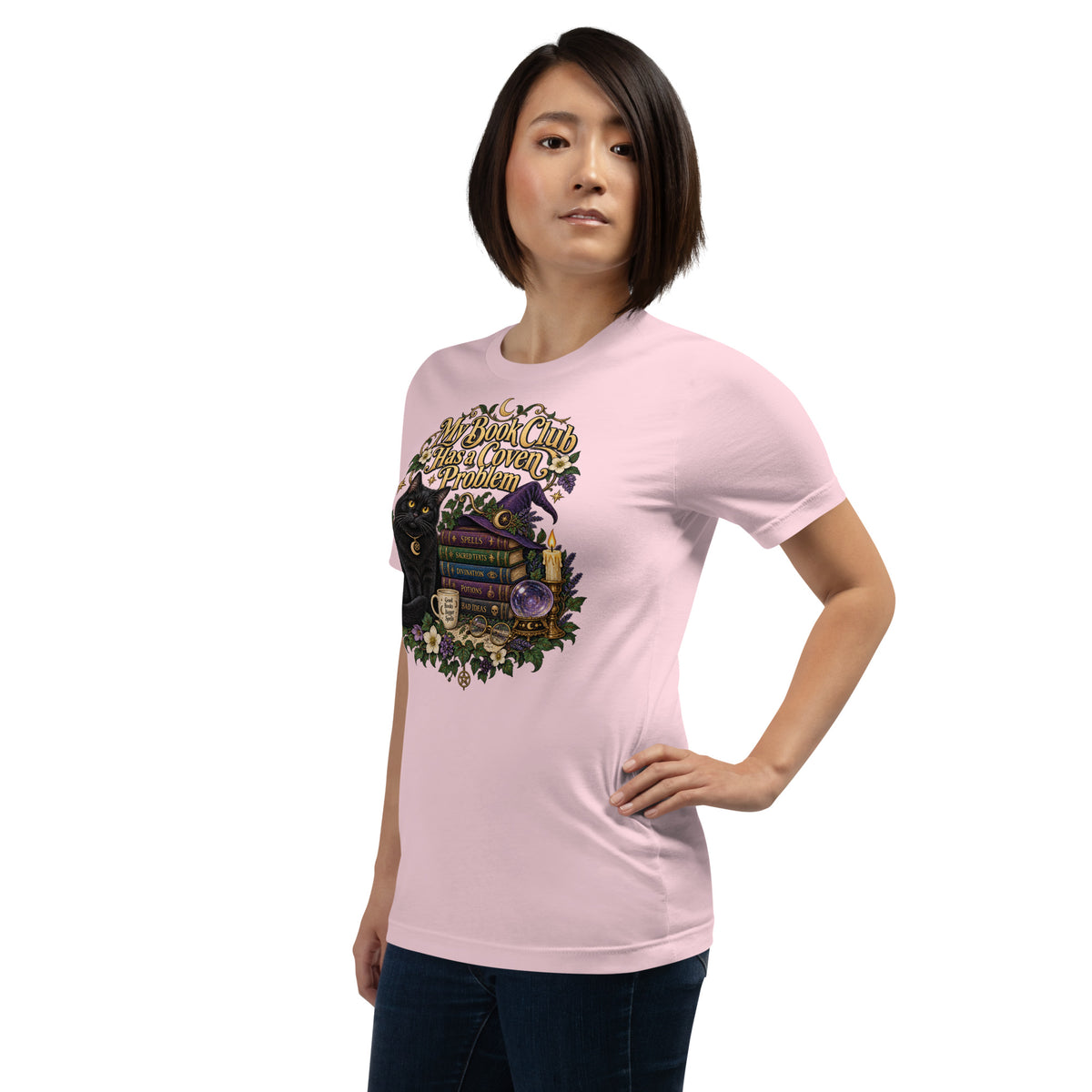 My Book Club Has A Coven Problem dark academia design, a witchy black cat and a stack of spellbooks, on a soft pink unisex t-shirt, left front view