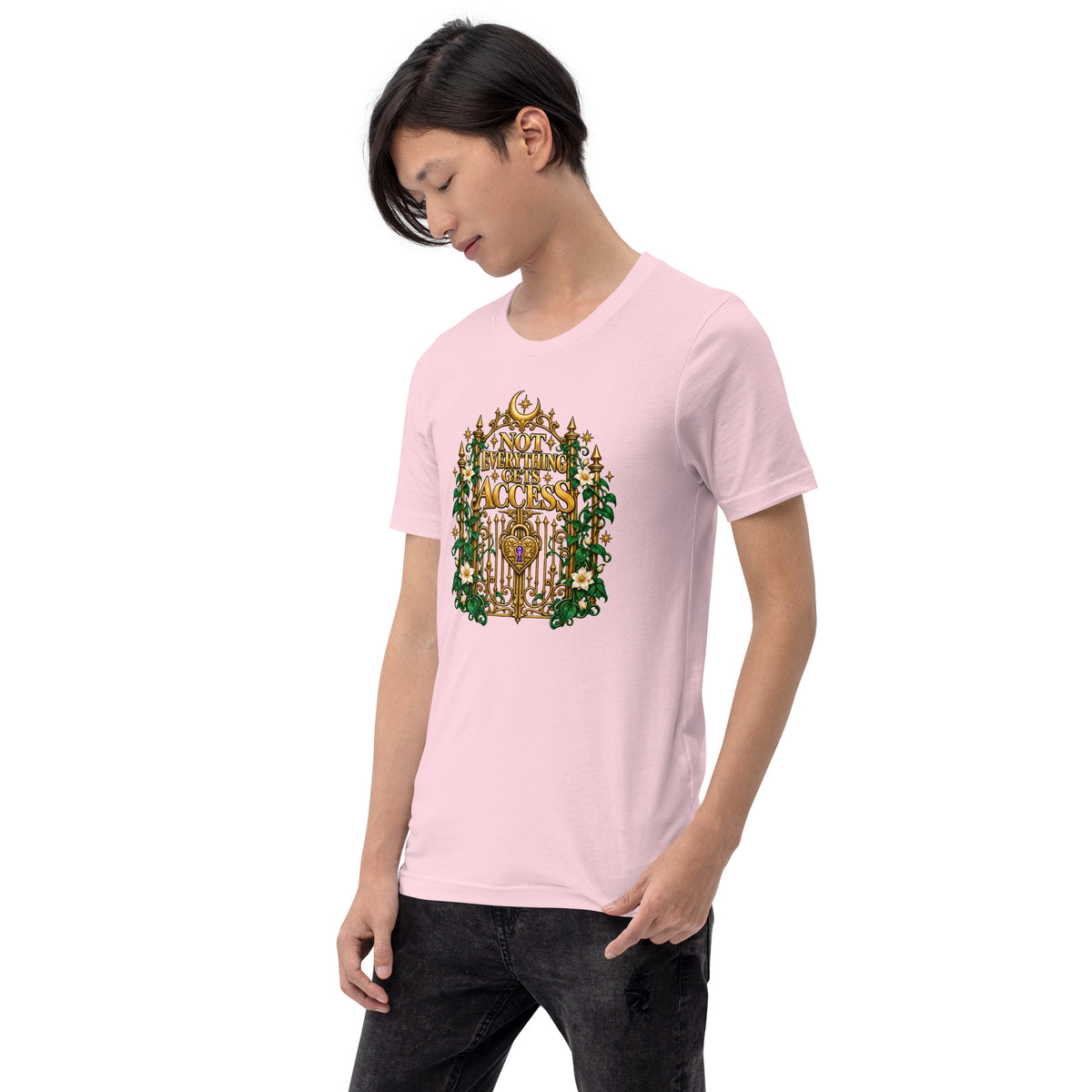 Not Everything Gets Access design, an ornate gold gate framed by ivy and white jasmine, on a soft pink unisex t-shirt worn by a model, angled to the left