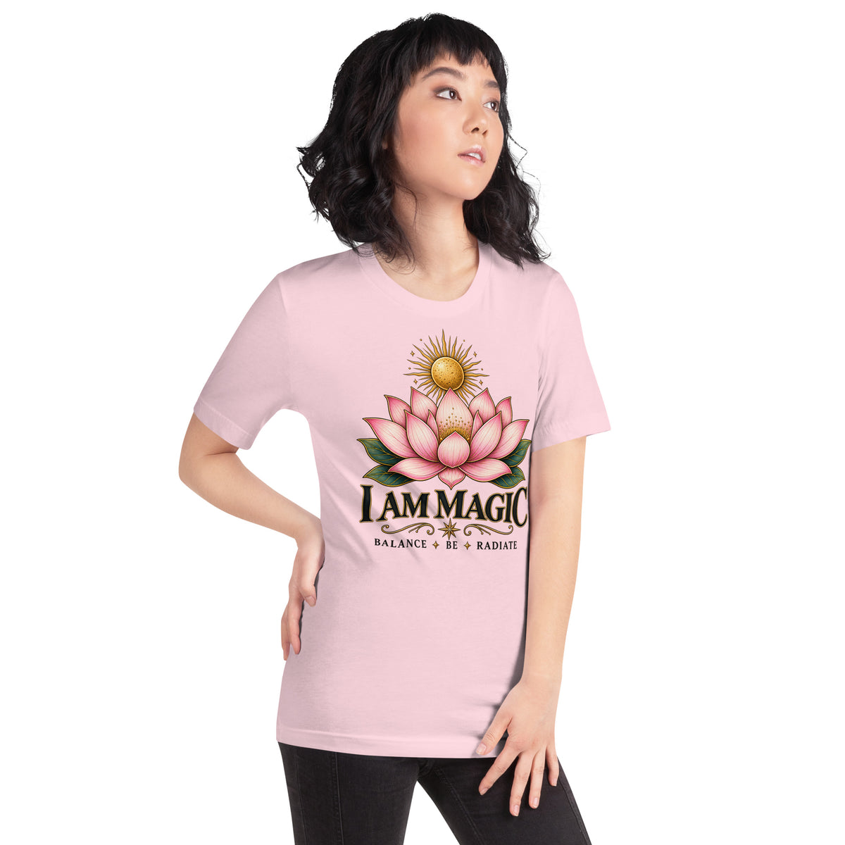 I Am Magic design with a gold lotus, Be Magical collection, on a soft pink unisex t-shirt, angled right front view