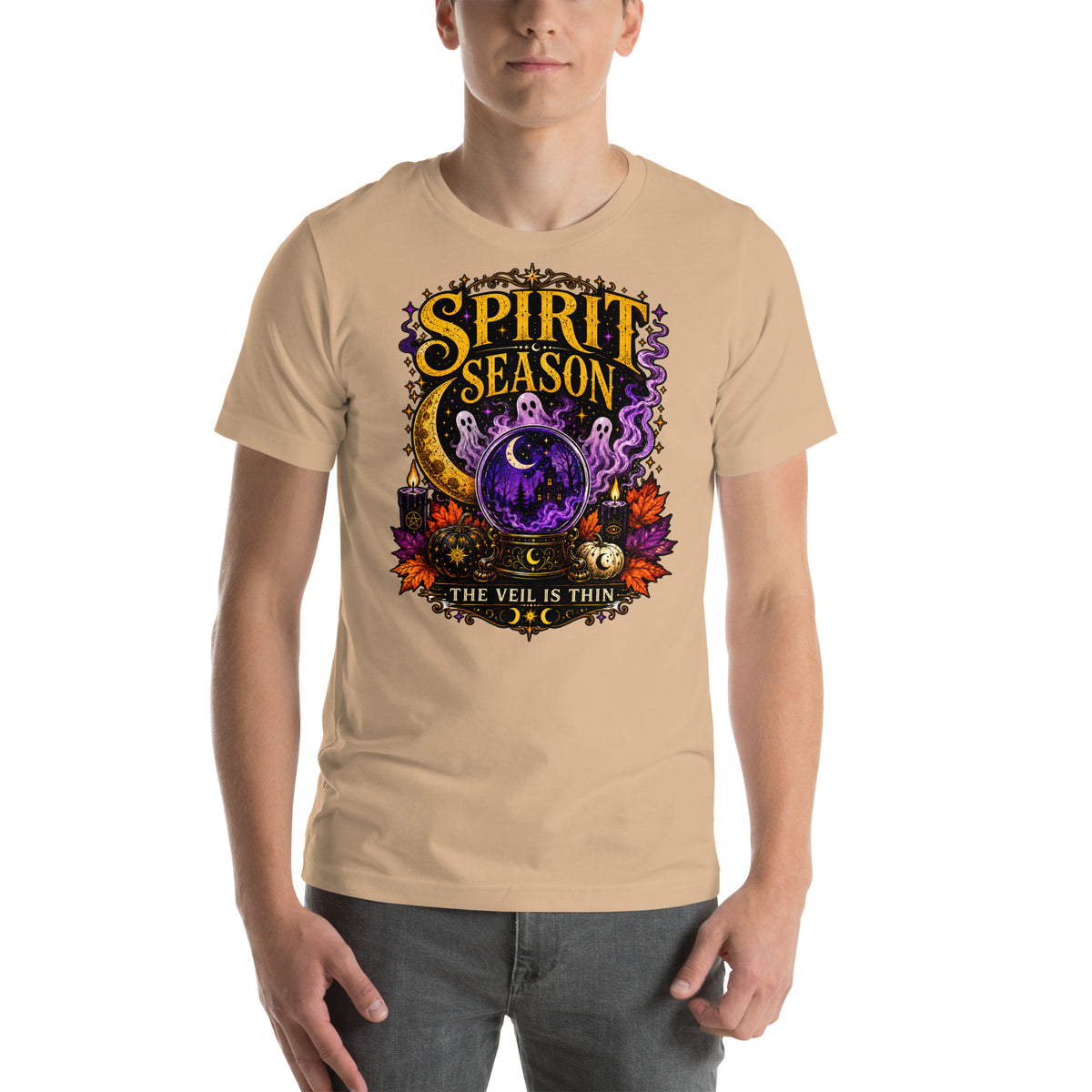 Spirit Season The Veil Is Thin design, three ghosts around a crystal ball, on a tan unisex t-shirt, front view