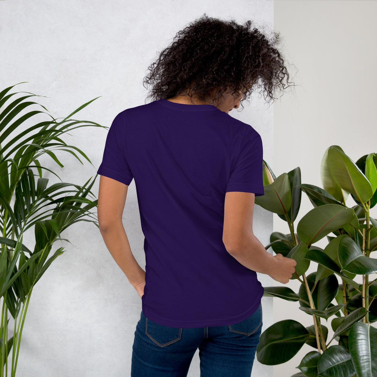 My Apothecary Has Trust Issues, a witchy black cat and a cabinet of potion bottles, on a team purple unisex t-shirt, back view