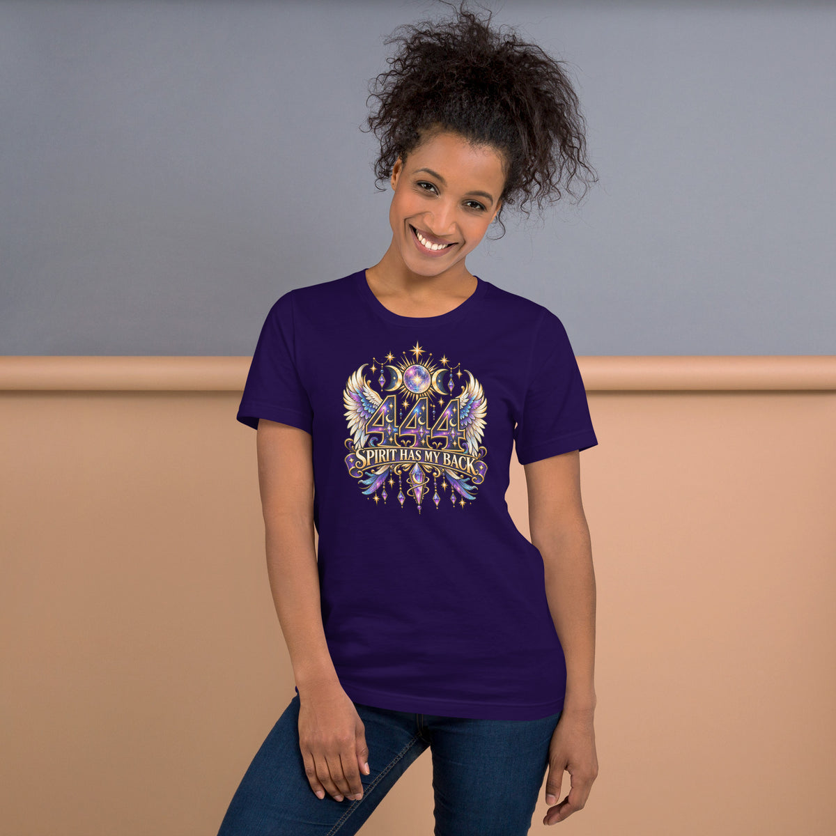 444 Spirit Has My Back angel number design, angel wings flanking the number beneath a galaxy orb and crescent moons, on a team purple unisex t-shirt, front view
