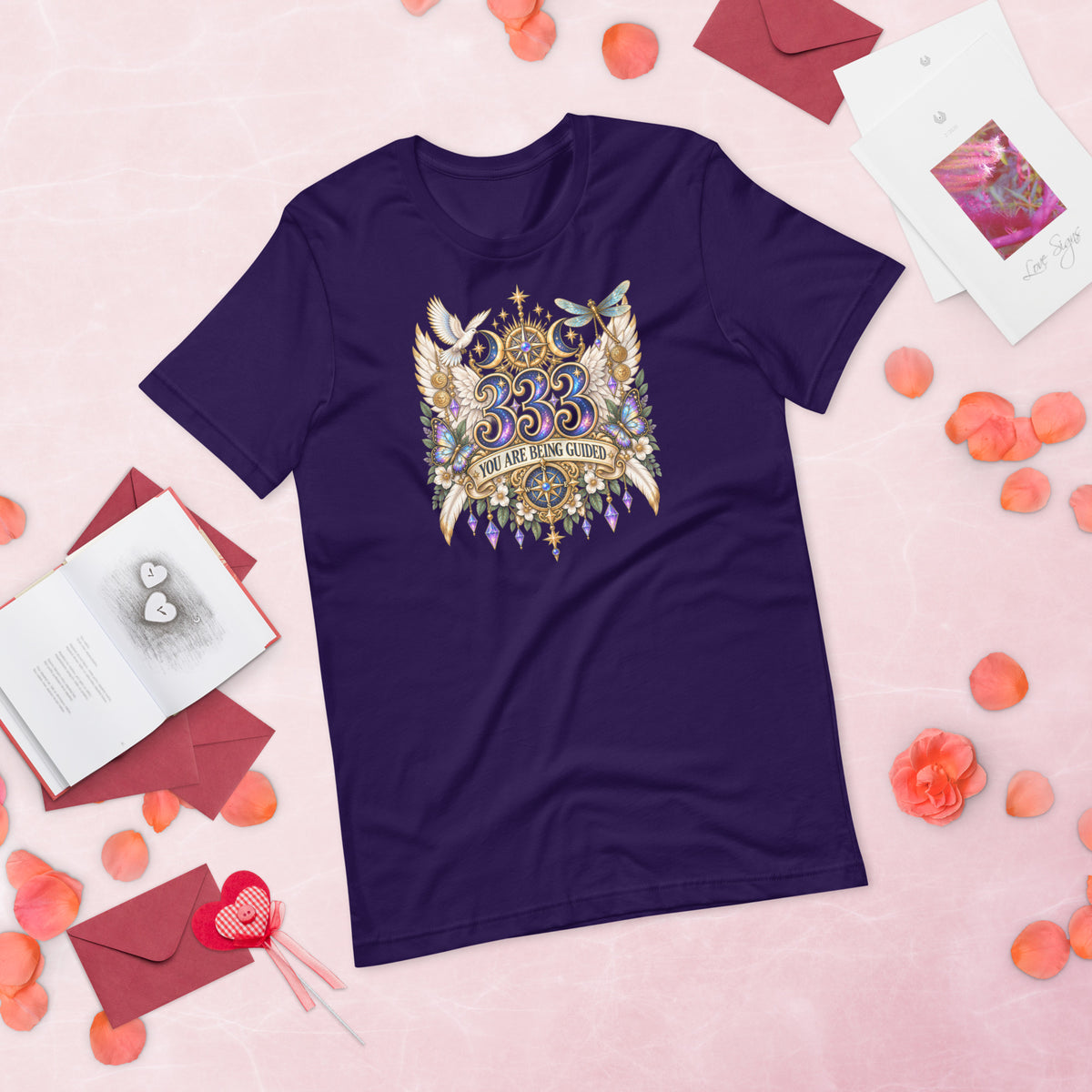 333 You Are Being Guided angel number design, a white dove, angel wings, a dragonfly and a compass rose, on a team purple unisex t-shirt, front view
